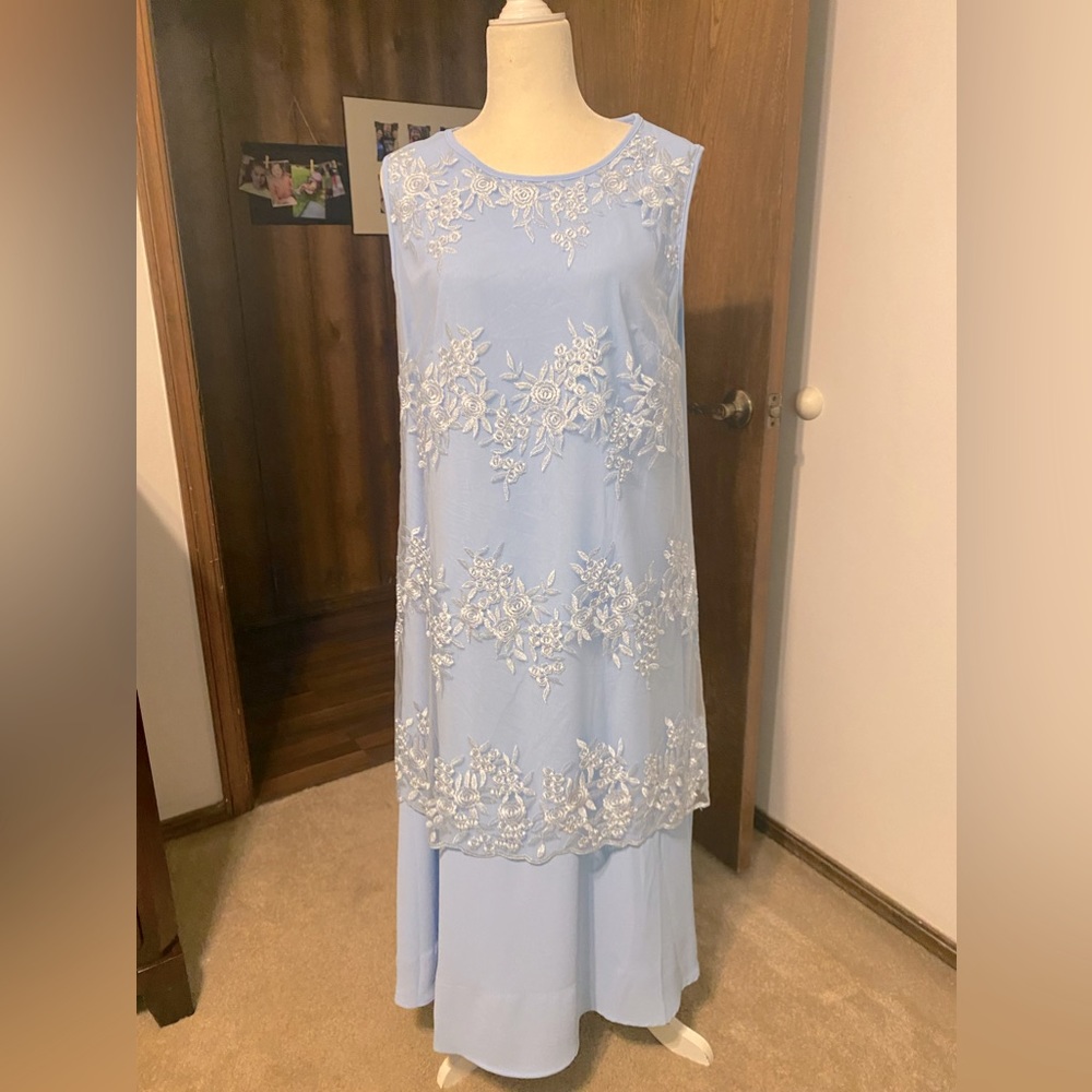 Mother’s dress. Light blue with sheer over skirt. Never worn.